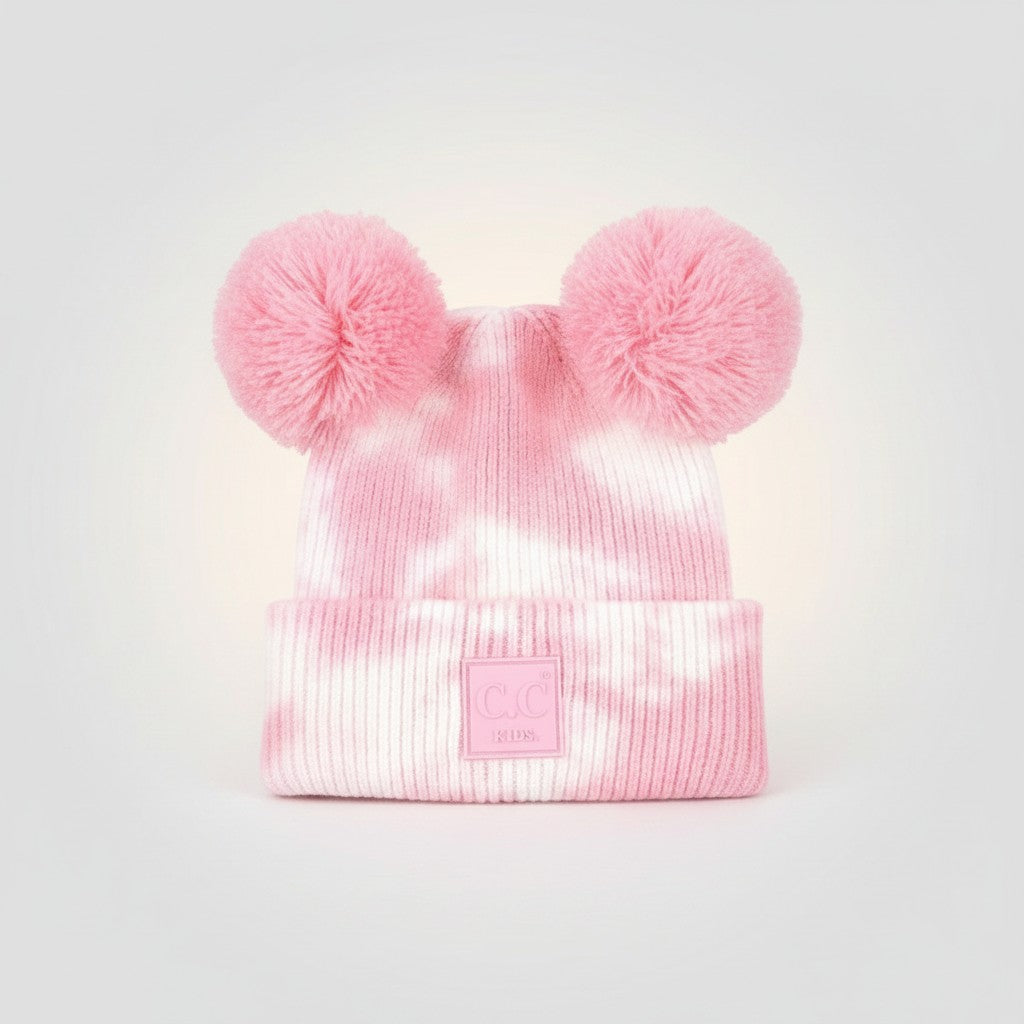 Truly Contagious pink and white tie-dye knit baby beanie with two fluffy pom-poms and a C.C. Kids patch.