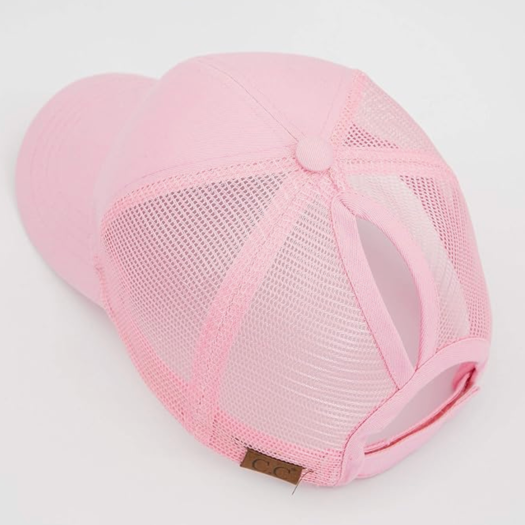 Pink mesh cap on a light gray background