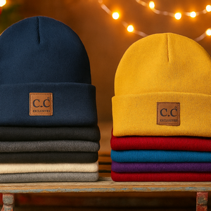 Stacks of beanies in various colors with a brand logo against a festive background.